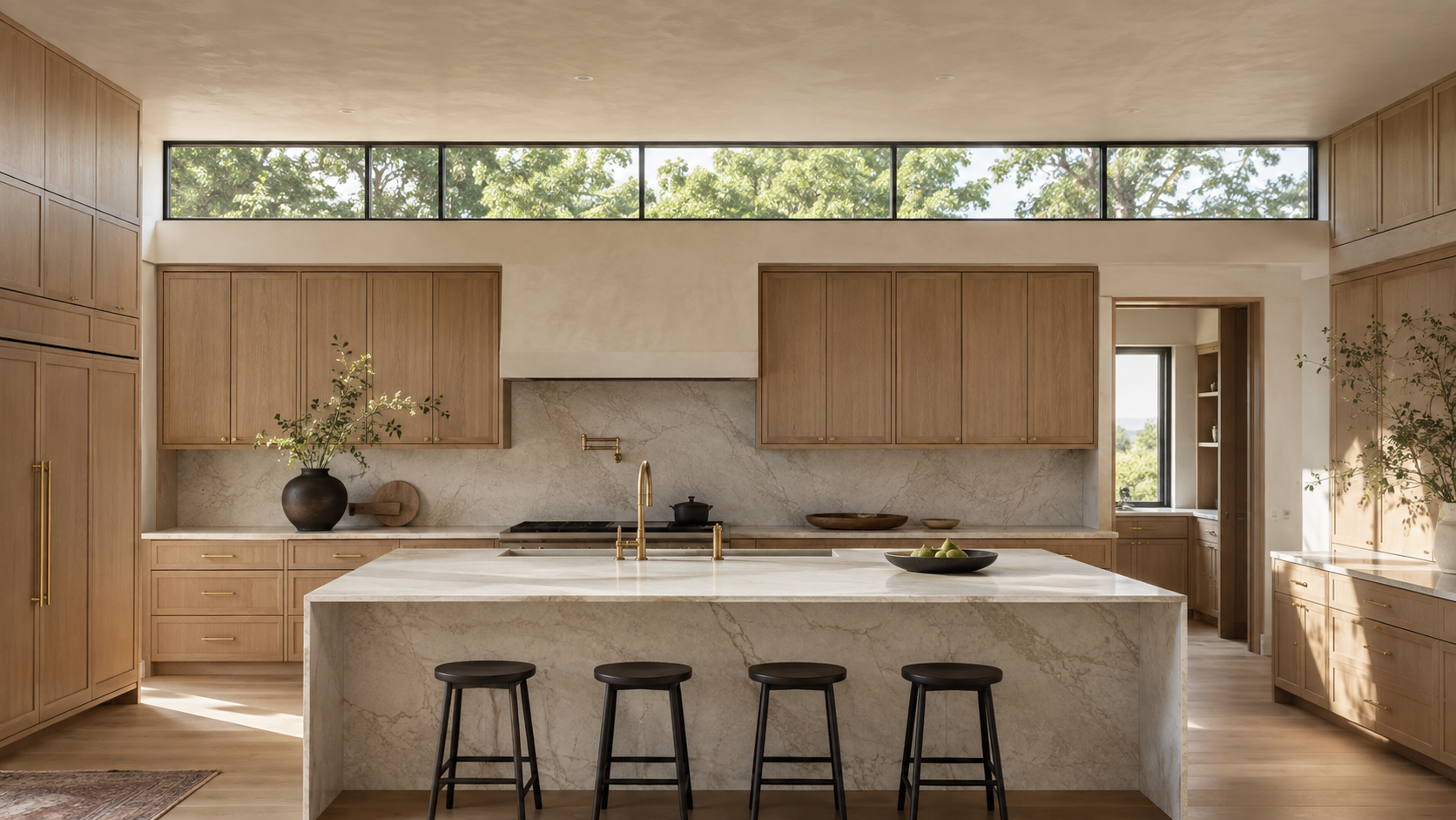 Clerestory window band above kitchen cabinets washing daylight across the ceiling