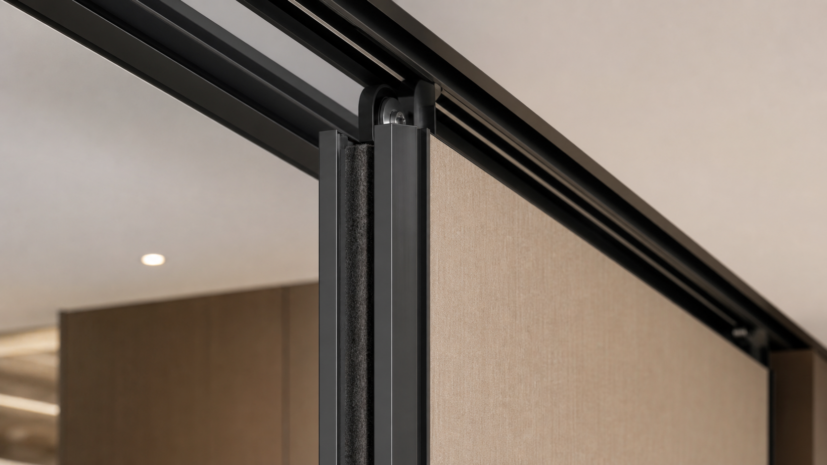Close-up of a sliding wall track and acoustic seal detail
