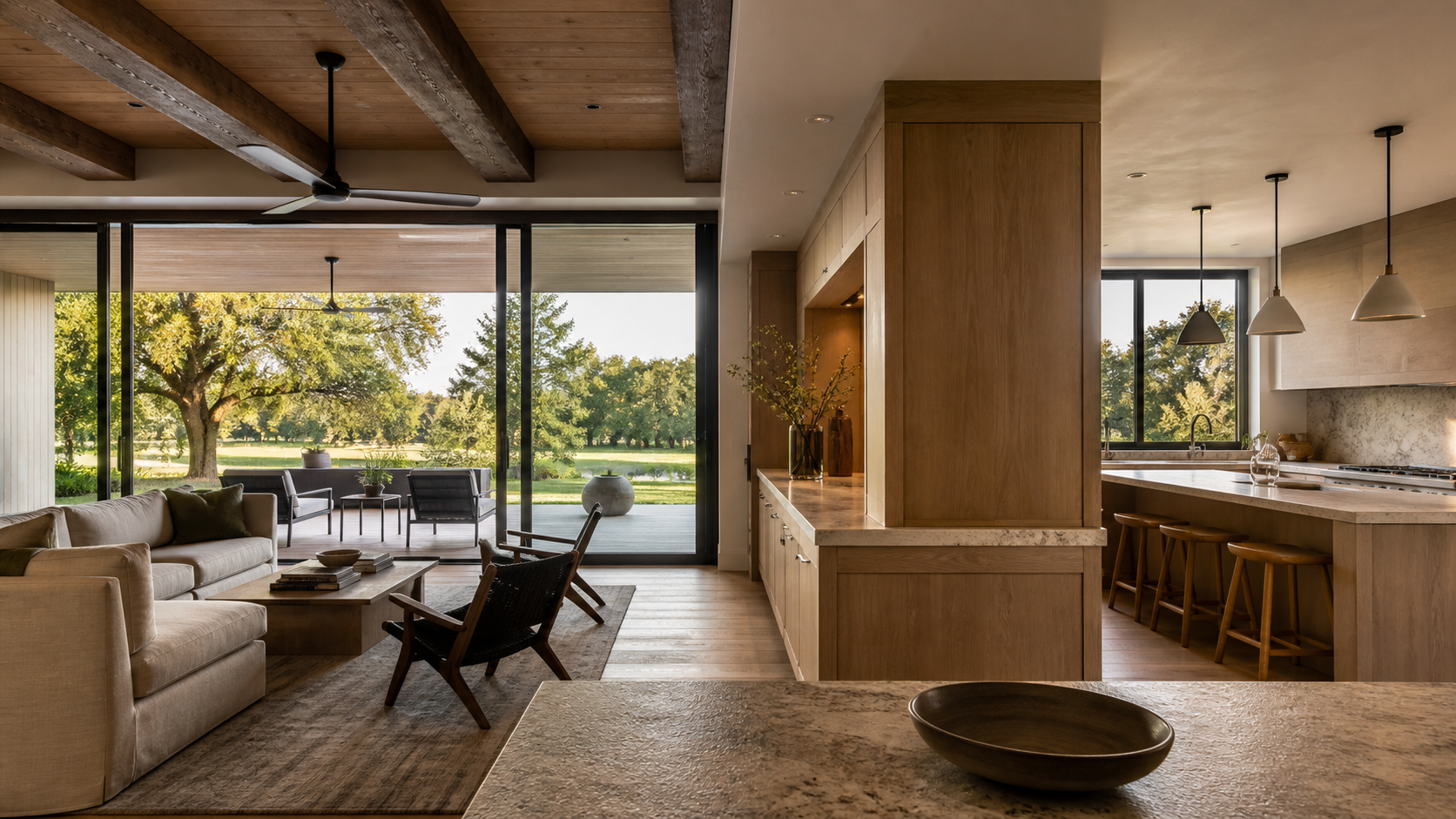 Main living floor with a glass wall to a covered porch and a double-sided cabinetry divider